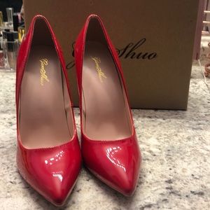 Red faux leather heels